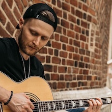 a man playing a guitar